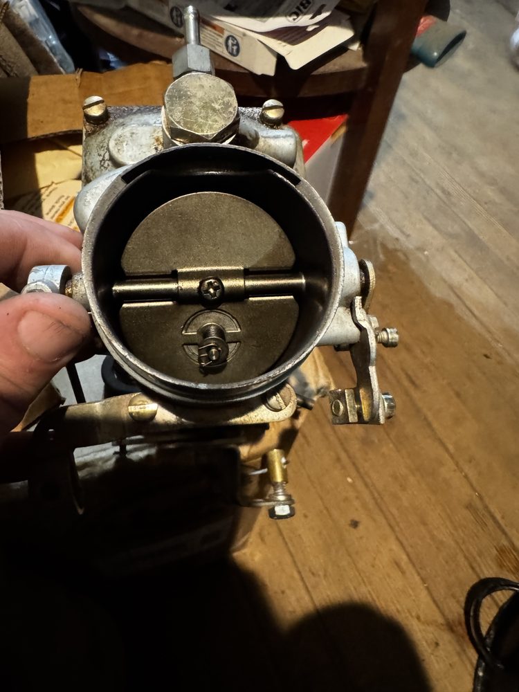 Air horn bore with choke plate 2 closed showing vacuum relief poppet valve